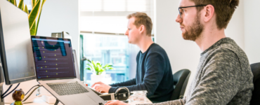 Two men working in a office