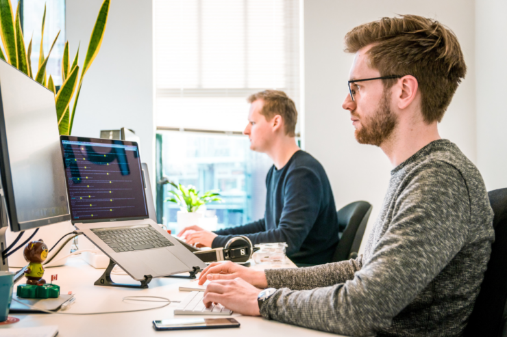 Two men working in a office